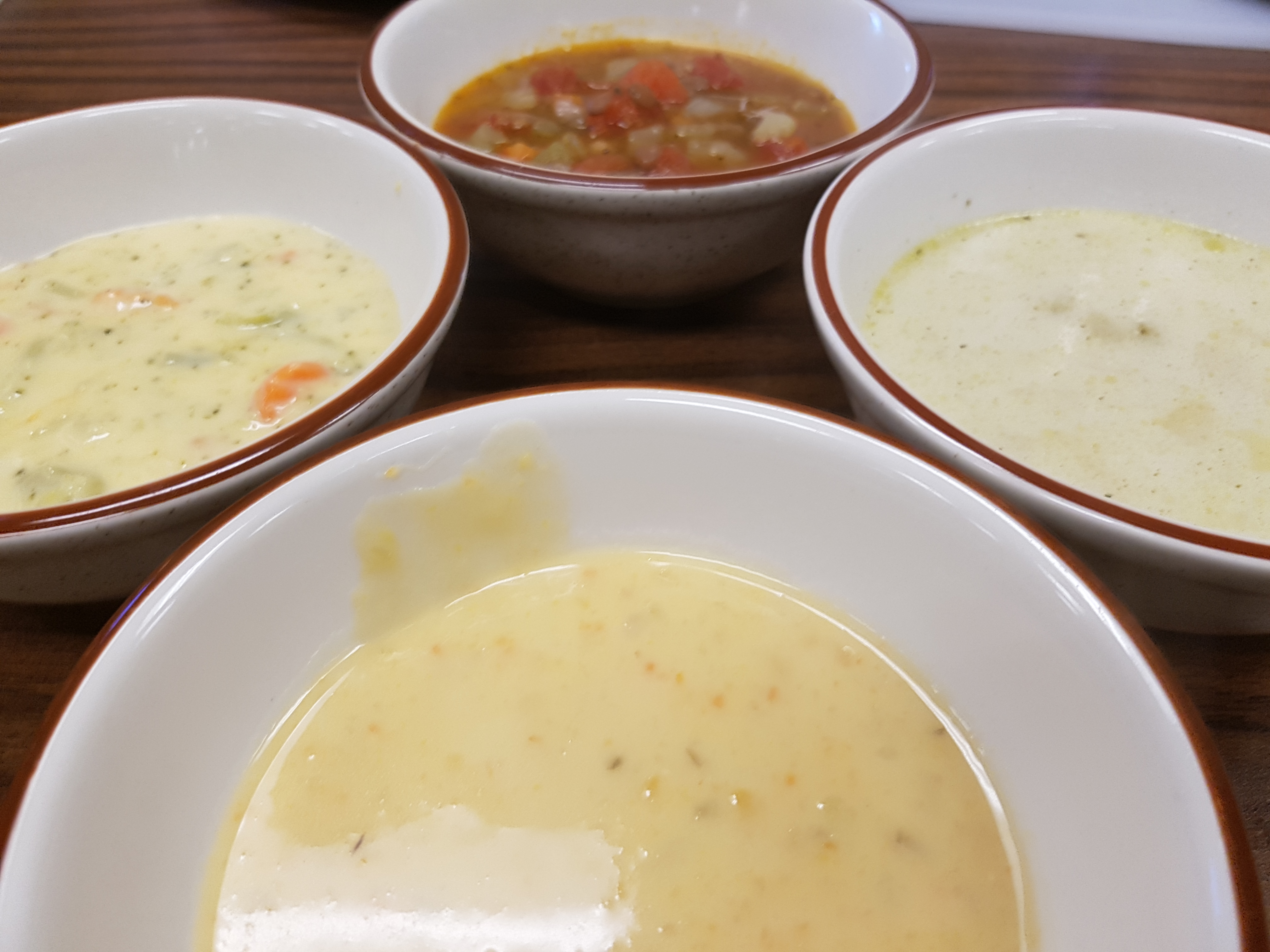 A picture of 4 different bowls of heart warming, home made soups