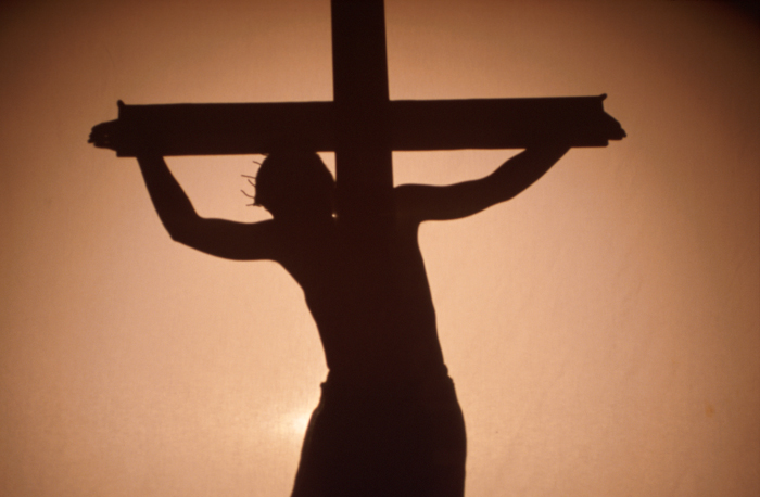 A picture of Jesus crucified. The angle suggest that the person is looking up toward the cross