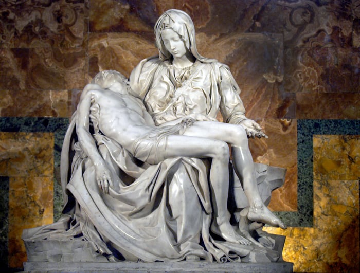 A sculpture of Mary holding her crucified son, Jesus, in her arms.