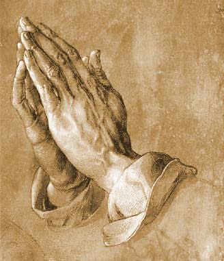 An image of hands together in prayer